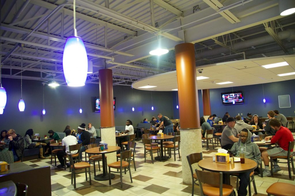 Students eating at tables in student union